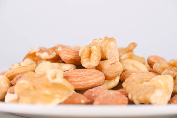 Loose mixed nuts on a white background