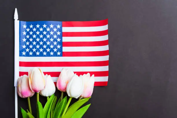 Photo of Happy Memorial Day, American flag and a Tulip flower