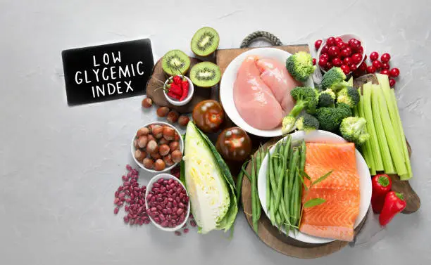 Photo of Foods with low glycemic index on gray background.