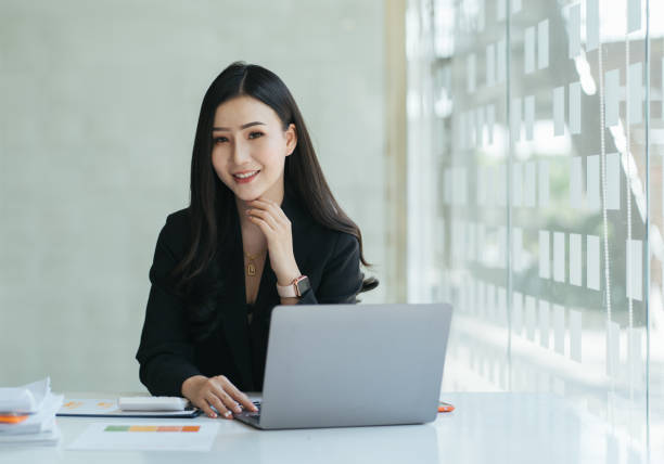 istock Beauitul young woman working using computer laptop concentrated and smiling 1386807710