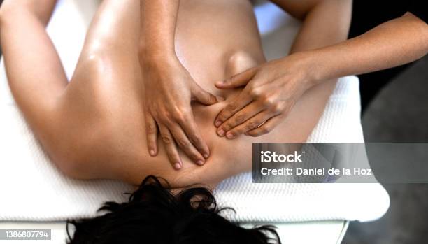 Top View Of Young Caucasian Woman Receiving A Deep Tissue Massage Stock Photo - Download Image Now