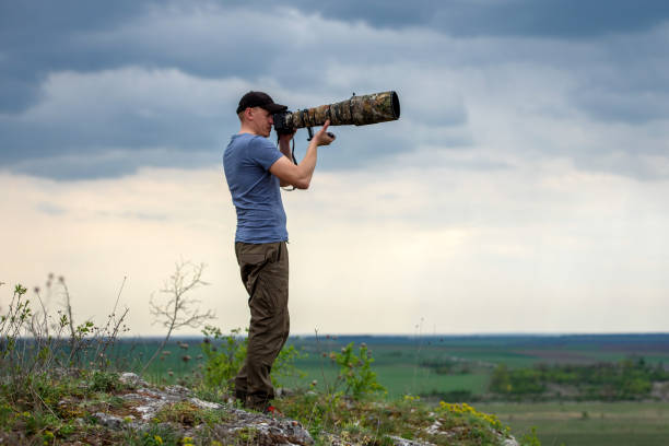 istock Wildlife photographer in summer time 1386811403