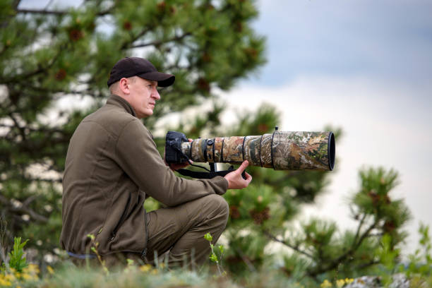 istock Wildlife photographer in summer time 1386811417