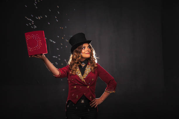 istock Female magician makes with soap bubbles show, an illusionist 1386813542