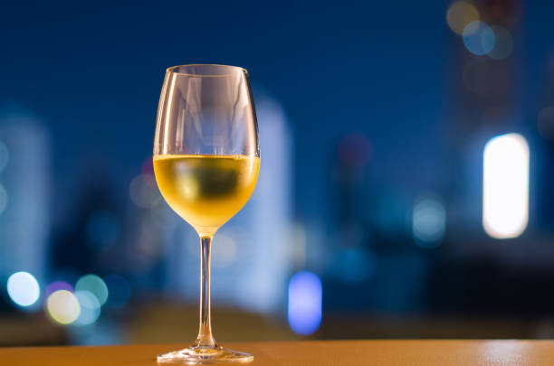 istock A glass of white wine puts on table at balcony 1386816302