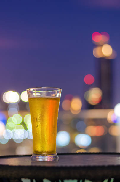istock A glass of beer puts on table at rooftop bar 1386816322
