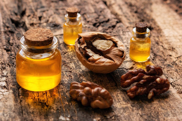 istock walnut oil on wooden background closeup 1386818806