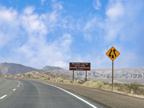 Roadside sign with distance to the Red Rock Canyon State Park and Ricardo Campground at the southern Sierra Nevada, California.