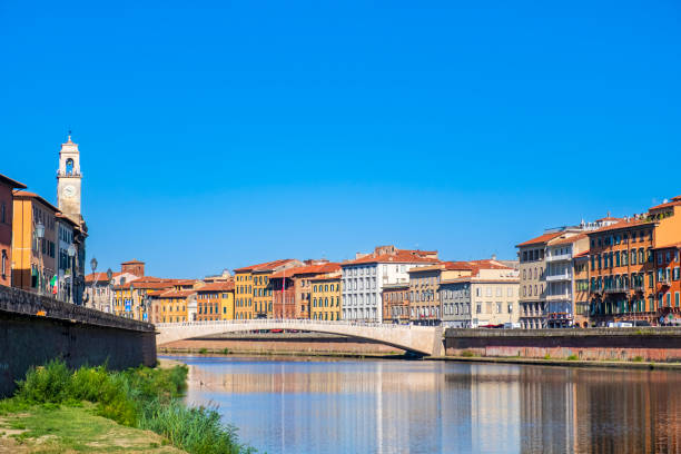 Pisa, Ponte di Mezzo & Lungarno (Tuscany, Italy) The Ponte di Mezzo is a historic bridge which spans the Arno river in the downtown of Pisa; pastel colored buildings are reflected in the water 2655 stock pictures, royalty-free photos & images