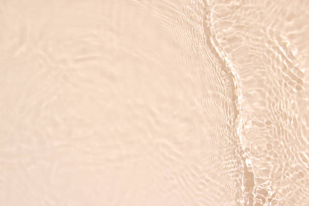 istock transparent beige colored clear calm water surface texture 1386825428
