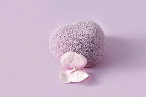 istock Mousse lavender heart-shaped cake on a purple background 1386827048