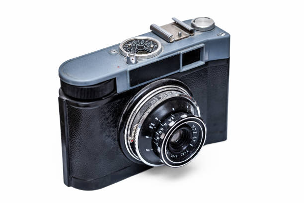 Old film photo camera isolated on white background