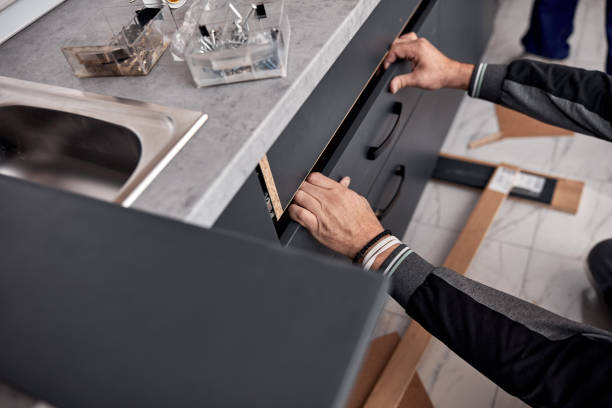 istock Handyman making kitchen wall cabinets in the apartment. 1386831013