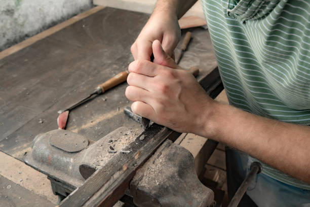 istock Man assembling furniture and fixing it - hobby garage concept. 1386831231