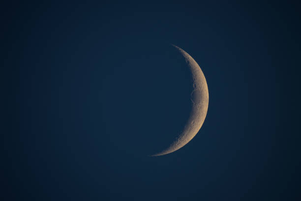 istock Young Moon on a dark sky photographed with astronomical telescope. 1386832748