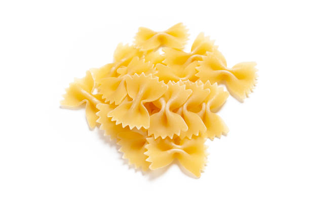 istock Tasty uncooked pasta on white background. 1386833587