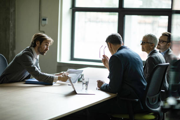 istock Male candidate talking to human resource team on a job interview. 1386836807