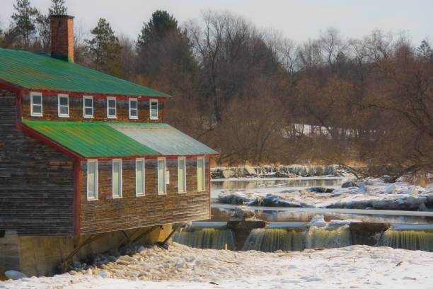 istock Water mill on the river in spring 1386837588
