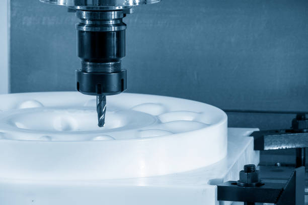 istock The CNC milling machine cutting the POM material parts by solid ball endmill tool. 1386839339