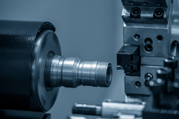 istock The  CNC lathe machine thread cutting the brass pipe connector parts. 1386839346