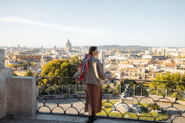 Woman enjoying beautiful morning cityscape of Rome stock photo