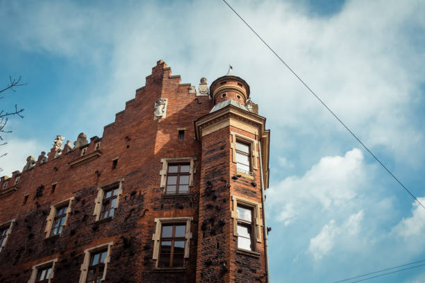 Krakow, Poland - April 21 2015: Facade of old building. Conrer of brown building in Krakow
