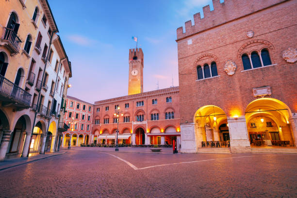 Treviso, Italy. Cityscape image of historical center of Treviso, Italy with old square at sunrise. clock tower photos stock pictures, royalty-free photos & images