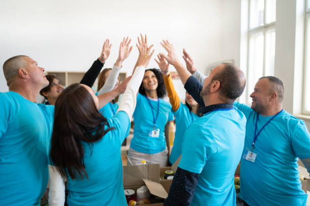 istock Team meeting ending on a high five from everyone 1386842662