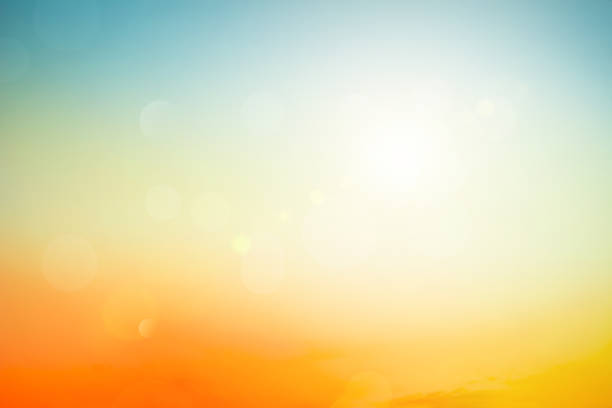 Relaxing outdoors vacation landscape concept: Abstract blurred sunlight beach colorful blurred bokeh background with retro effect autumn sunset sky have blue bright, white, and color orange calm. Relaxing outdoors vacation landscape concept: Abstract blurred sunlight beach colorful blurred bokeh background with retro effect autumn sunset sky have blue bright, white, and color orange calm. warm sunset stock pictures, royalty-free photos & images