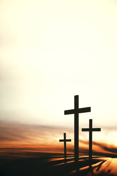 sky and clouds holy cross of jesus christ and ray of light The three holy crosses of Jesus Christ shining through the red sky and clouds and bright rays background holy book stock pictures, royalty-free photos & images