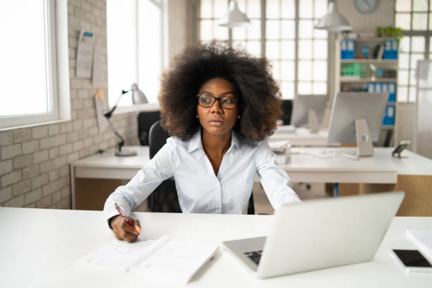 istock Business woman working in office 1386843641