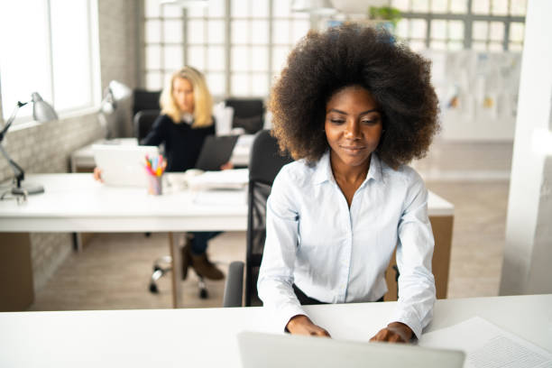 istock A secretary typing on a laptop 1386843653