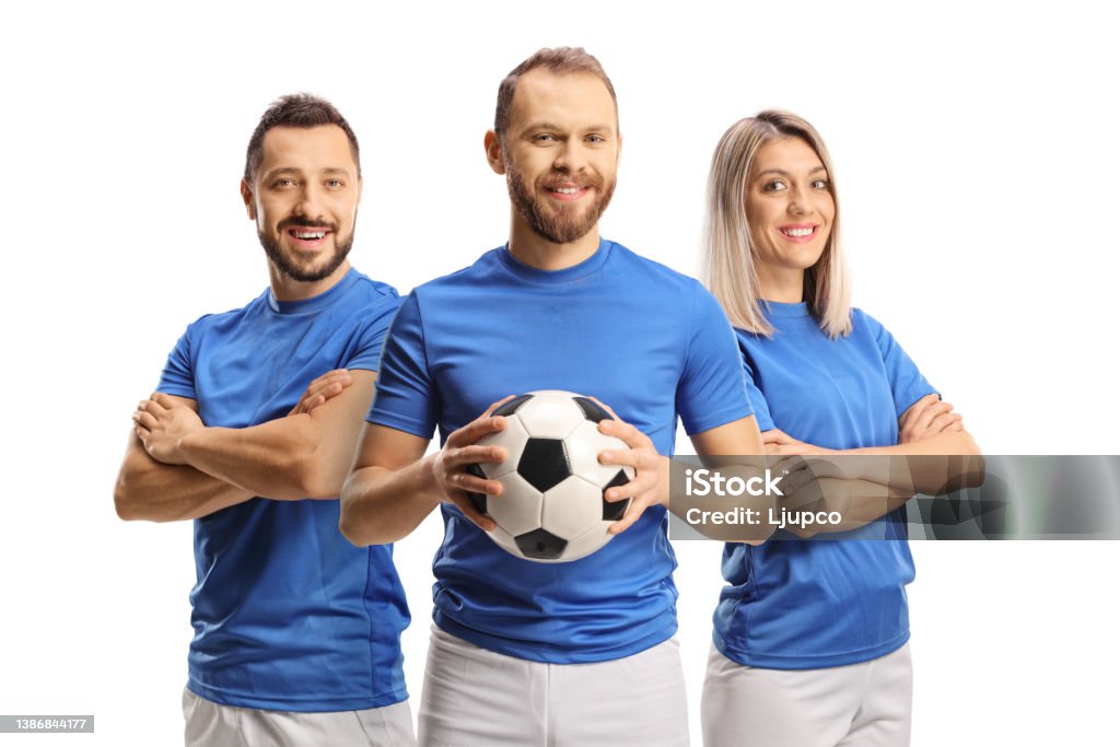 Male and female football players smiling at camera Male and female football players smiling at camera isolated on white background Soccer Stock Photo