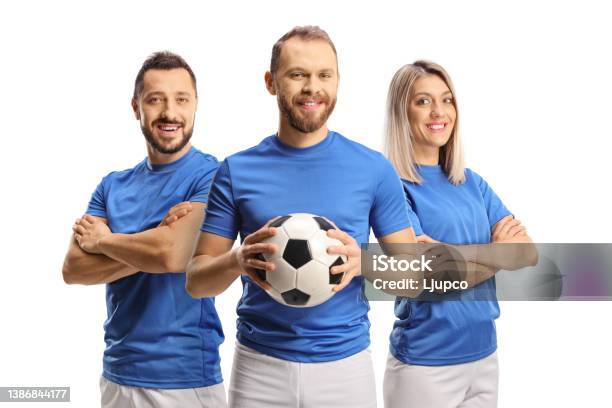 Male And Female Football Players Smiling At Camera Stock Photo - Download Image Now - Soccer, Men, Sports Ball