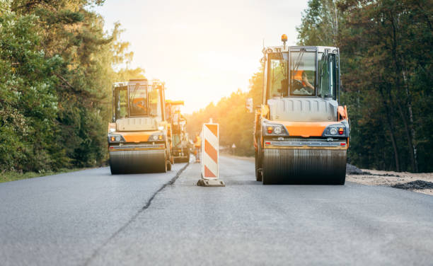 istock Vibratory asphalt rollers compactor compacting new asphalt pavement. Road service repairs the highway 1386844446