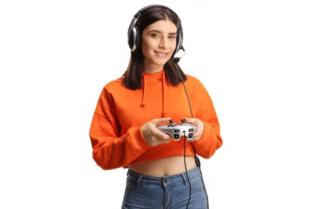 Photo of Cheerful young female with headphones and joystick