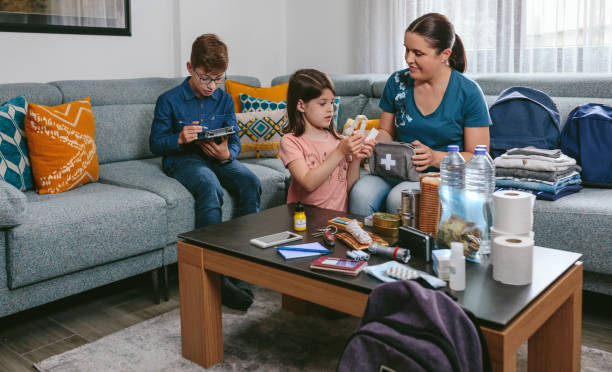 istock Mother preparing emergency backpack with her children 1386845809