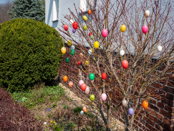 Easter eggs hanging as a decoration on a flowering bush