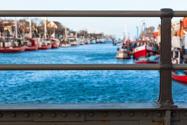 View from steel girder bridge to small town harbor (copy space)