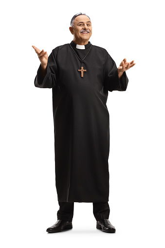 Full length portrait of a smiling priest gesturing with hands isolated on white background
