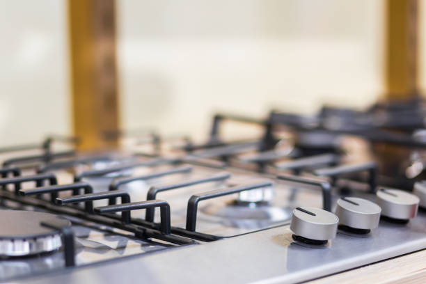 istock Gas stove burner close-up on a blurred background 1386846462