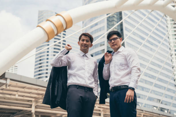 istock Two businessman people achieving goals 1386847401