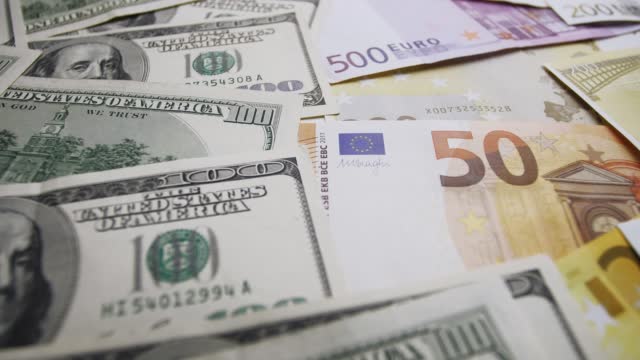 Footage from dissimilar cash banknotes of different states of the European Union and the United States of America.