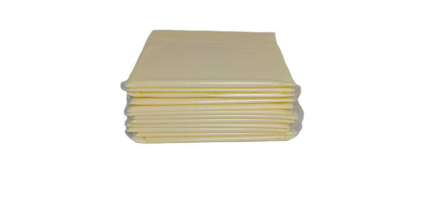 istock A pile of cheese slices isolated on white background 1386848664