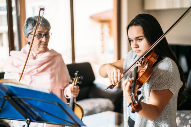 istock Teacher and student during the violin lesson 1386850332