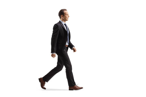 istock Profile shot of a businessman walking 1386850788