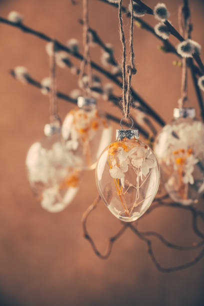 istock Holidays and Easter concept - close up of pussy willow branches decorated with Easter eggs 1386852171
