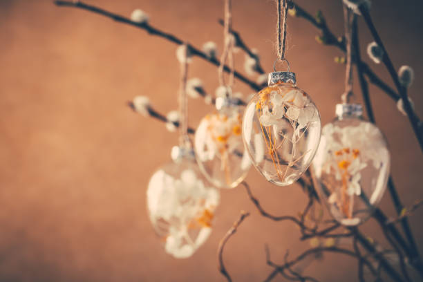 istock Holidays and Easter concept - close up of pussy willow branches decorated with Easter eggs 1386852204