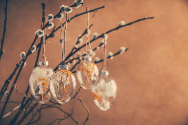 istock Holidays and Easter concept - close up of pussy willow branches decorated with Easter eggs 1386852228