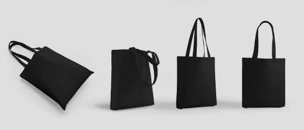 istock Black totebag 3d rendering mockup with handles, isolated on background, ecological sack set for retail. 1386855485